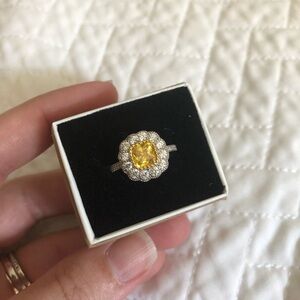 Costume jewelry ring, yellow with white halo